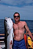 Jody Short and North Pacific Yellowtail, Islas San Benito. San Benito Islands (Islas San Benito), Baja California, Mexico. Image #02386