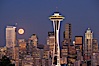 Full moon rises over Seattle city skyline at dusk, Space Needle at right. Seattle, Washington, USA. Image #13661