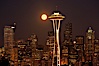 Full moon rises over Seattle city skyline, Space Needle at right. Seattle, Washington, USA. Image #13662