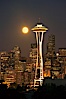 Full moon rises over Seattle city skyline, Space Needle at right. Seattle, Washington, USA. Image #13665
