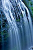 Narada Falls cascades down a cliff, with the flow blurred by a time exposure.  Narada Falls is a 188 foot (57m) waterfall in Mount Rainier National Park. Narada Falls, Mount Rainier National Park, Washington, USA. Image #13843