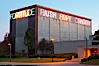 Vices and Virtues, part of the Stuart Collection and University of California, San Diego (UCSD).  Artist Bruce Naumann created Vices and Virtues in 1988 along the top of the Charles Lee Powell Structural Systems Laboratory at UCSD.  Vices and virtues named in alternating neon light blink bizarrely around the building, lighting the night sky at UCSD.  Very odd. University of California, San Diego, La Jolla, California, USA. Image #14771