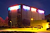 Vices and Virtues, part of the Stuart Collection and University of California, San Diego (UCSD).  Artist Bruce Naumann created Vices and Virtues in 1988 along the top of the Charles Lee Powell Structural Systems Laboratory at UCSD.  Vices and virtues named in alternating neon light blink bizarrely around the building, lighting the night sky at UCSD.  Very odd. University of California, San Diego, La Jolla, California, USA. Image #14772
