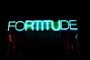 Vices and Virtues, part of the Stuart Collection and University of California, San Diego (UCSD).  Artist Bruce Naumann created Vices and Virtues in 1988 along the top of the Charles Lee Powell Structural Systems Laboratory at UCSD.  Vices and virtues named in alternating neon light blink bizarrely around the building, lighting the night sky at UCSD.  Very odd. University of California, San Diego, La Jolla, California, USA. Image #14774
