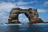 Darwins Arch, a dramatic 50-foot tall natural lava arch, rises above the ocean a short distance offshore of Darwin Island. Galapagos Islands, Ecuador
