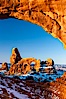 Sunrise light on Turret Arch viewed through North Window, winter. North Window, Arches National Park, Utah, Utah, USA. Image #18119
