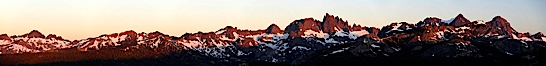 Panorama of the Minarets at sunrise, near Mammoth Mountain.  The Minarets are a series of seventeen jagged peaks in the Ritter Range, west of Mammoth Mountain in the Ansel Adams Wilderness.  These basalt peaks were carved by glaciers on both sides of the range.  The highest of the Minarets stands 12,281 feet above sea level. Mammoth Lakes, California, USA. Image #19123