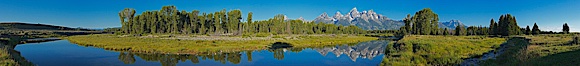 Panorama of the Teton Range reflected in the still waters of Schwabacher Landing, a sidewater of the Snake River. Grand Teton National Park, Wyoming, USA. Image #19129