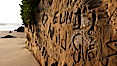 Graffiti is carved into soft sandstone cliffs at the beach. Carlsbad, California, USA. Image #19812