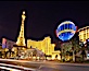 Half-scale replica of the Eiffel Tower rises above Las Vegas Boulevard, the Strip, in front of the Paris Hotel. Las Vegas, Nevada, USA. Image #20558
