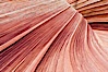 The Wave, an area of fantastic eroded sandstone featuring beautiful swirls, wild colors, countless striations, and bizarre shapes set amidst the dramatic surrounding North Coyote Buttes of Arizona and Utah.  The sandstone formations of the North Coyote Buttes, including the Wave, date from the Jurassic period. Managed by the Bureau of Land Management, the Wave is located in the Paria Canyon-Vermilion Cliffs Wilderness and is accessible on foot by permit only. North Coyote Buttes, Paria Canyon-Vermilion Cliffs Wilderness, Arizona, USA. Image #20607