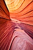 The Wave, an area of fantastic eroded sandstone featuring beautiful swirls, wild colors, countless striations, and bizarre shapes set amidst the dramatic surrounding North Coyote Buttes of Arizona and Utah.  The sandstone formations of the North Coyote Buttes, including the Wave, date from the Jurassic period. Managed by the Bureau of Land Management, the Wave is located in the Paria Canyon-Vermilion Cliffs Wilderness and is accessible on foot by permit only. North Coyote Buttes, Paria Canyon-Vermilion Cliffs Wilderness, Arizona, USA. Image #20609