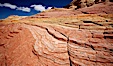 Striations in sandstone tell of eons of sedimentary deposits, a visible geologic record of the time when this region was under the sea. North Coyote Buttes, Paria Canyon-Vermilion Cliffs Wilderness, Arizona, USA. Image #20612
