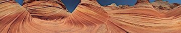 Panorama of the Wave.  The Wave is a sweeping, dramatic display of eroded sandstone, forged by eons of water and wind erosion, laying bare striations formed from compacted sand dunes over millenia.  This panoramic picture is formed from thirteen individual photographs. North Coyote Buttes, Paria Canyon-Vermilion Cliffs Wilderness, Arizona, USA. Image #20700