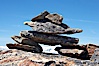 A small cairn of stones at the top of Whistler Mountain. Whistler, British Columbia, Canada. Image #21011