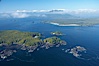 Blunden Island (foreground) and Vargas Island (distance), surrounded by the waters of Clayoquot Sound, west coast of Vancouver Island. Tofino, British Columbia, Canada. Image #21069