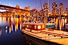 Yaletown section of Vancouver at night, including Granville Island bridge (left), viewed from Granville Island with sailboat in the foreground. Granville Island, Vancouver, British Columbia, Canada. Image #21169