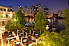 Vancouver and harbor at night, viewed from Granville Island Hotel with restaurant courtyard in the foreground. Granville Island, Vancouver, British Columbia, Canada. Image #21170