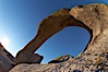 Mobius Arch in golden early morning light.  The natural stone arch is found in the scenic Alabama Hlls near Lone Pine, California. Alabama Hills Recreational Area, California, USA. Image #21735