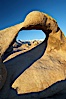 Mobius Arch in golden early morning light.  The natural stone arch is found in the scenic Alabama Hlls near Lone Pine, California. Alabama Hills Recreational Area, California, USA. Image #21739