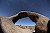 Mobius Arch in the Alabama Hills, seen here at night with swirling star trails formed in the sky above due to a long time exposure. Alabama Hills Recreational Area, California, USA. Image #21744