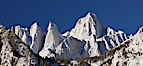 Mt. Whitney is the highest point in the contiguous United States with an elevation of 14,505 feet (4,421 m).  It lies along the crest of the Sierra Nevada mountain range.  Composed of the Sierra Nevada batholith granite formation, its eastern side (seen here) is quite steep.  It is climbed by hundreds of hikers each year. Image #21761