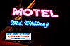 Mt. Whitney Hotel, near signs at night. Lone Pine, California, USA. Image #21764