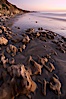 Rocks, sand, ocean and sea cliffs, sunset. Carlsbad, California, USA. Image #22199