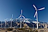 Wind turbines, rise above the flat floor of the San Gorgonio Pass near Palm Springs, with snow covered Mount San Jacinto in the background, provide electricity to Palm Springs and the Coachella Valley. San Gorgonio Pass, Palm Springs, California, USA. Image #22205