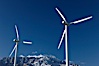 Wind turbines, rise above the flat floor of the San Gorgonio Pass near Palm Springs, with snow covered Mount San Jacinto in the background, provide electricity to Palm Springs and the Coachella Valley. San Gorgonio Pass, Palm Springs, California, USA. Image #22206