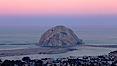Earth shadow over Morro Rock and Morro Bay.  Just before sunrise the shadow of the Earth can seen as the darker sky below the pink sunrise. Morro Bay, California, USA. Image #22213