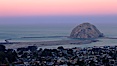 Earth shadow over Morro Rock and Morro Bay.  Just before sunrise the shadow of the Earth can seen as the darker sky below the pink sunrise. Morro Bay, California, USA. Image #22214