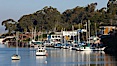 Morro Bay, boats and Morro Rock in the distance. Morro Bay, California, USA. Image #22229