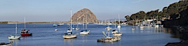 Morro Bay, boats and Morro Rock in the distance. Morro Bay, California, USA. Image #22246