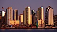 San Diego city skyline at sunset, showing the buildings of downtown San Diego rising above San Diego Harbor, viewed from Harbor Island. San Diego, California, USA. Image #22249
