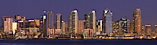 San Diego city skyline at sunset, showing the buildings of downtown San Diego rising above San Diego Harbor, viewed from Harbor Island.  A panoramic photograph, composite of thirteen separate images. San Diego, California, USA. Image #22255