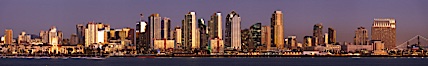 San Diego city skyline at sunset, showing the buildings of downtown San Diego rising above San Diego Harbor, viewed from Harbor Island.  A panoramic photograph, composite of six separate images. San Diego, California, USA. Image #22256