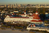 Hotel del Coronado, known affectionately as the Hotel Del.  It was once the largest hotel in the world, and is one of the few remaining wooden Victorian beach resorts.  It sits on the beach on Coronado Island, seen here with downtown San Diego in the distance.  It is widely considered to be one of Americas most beautiful and classic hotels. Built in 1888, it was designated a National Historic Landmark in 1977. California, USA. Image #22287