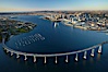 San Diego Coronado Bridge, known locally as the Coronado Bridge, links San Diego with Coronado, California.  The bridge was completed in 1969 and was a toll bridge until 2002.  It is 2.1 miles long and reaches a height of 200 feet above San Diego Bay.  Coronado Island is to the left, and downtown San Diego is to the right in this view looking north. San Diego, California, USA. Image #22288