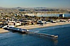 Crystal Pier, 872 feet long and built in 1925, extends out into the Pacific Ocean from the town of Pacific Beach.  Mission Bay and downtown San Diego are seen in the distance. San Diego, California, USA. Image #22294