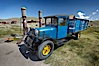 Old truck and gas station, in front of Boone Store and Warehouse, Main Street and Green Street. Bodie State Historical Park, California, USA. Image #23108