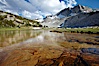 Townsley Lake (10396'), a beautiful alpine lake sitting below blue sky, clouds and Fletcher Peak (right), lies amid the Cathedral Range of glacier-sculpted granite peaks in Yosemite's high country, near Vogelsang High Sierra Camp. Yosemite National Park, California, USA. Image #23206