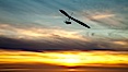 Hang Glider soaring at Torrey Pines Gliderport, sunset, flying over the Pacific Ocean. La Jolla, California, USA. Image #24291