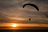 Paraglider soaring at Torrey Pines Gliderport, sunset, flying over the Pacific Ocean. La Jolla, California, USA. Image #24296