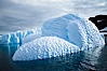 Iceberg with scalloped erosion.  The eroded indentations on this iceberg were melted when this portion of the iceberg was underwater.  As it melted, the iceberg grew topheavy, eventually flipping and exposing this interesting surface. Paulet Island, Antarctic Peninsula, Antarctica. Image #24789