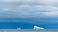 Iceberg, ocean, light and clouds.  Light plays over icebergs and the ocean near Coronation Island. Coronation Island, South Orkney Islands, Southern Ocean. Image #24797
