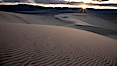 Sunset on the Eureka Dunes.  The Eureka Valley Sand Dunes are California's tallest sand dunes, and one of the tallest in the United States.  Rising 680' above the floor of the Eureka Valley, the Eureka sand dunes are home to several endangered species, as well as "singing sand" that makes strange sounds when it shifts.  Located in the remote northern portion of Death Valley National Park, the Eureka Dunes see very few visitors. Eureka Dunes, Death Valley National Park, California, USA. Image #25240
