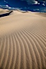 Eureka Dunes.  The Eureka Valley Sand Dunes are California's tallest sand dunes, and one of the tallest in the United States.  Rising 680' above the floor of the Eureka Valley, the Eureka sand dunes are home to several endangered species, as well as "singing sand" that makes strange sounds when it shifts.  Located in the remote northern portion of Death Valley National Park, the Eureka Dunes see very few visitors. Eureka Dunes, Death Valley National Park, California, USA. Image #25250