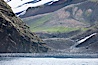 Chinstrap penguins at Bailey Head, Deception Island.  Chinstrap penguins enter and exit the surf on the black sand beach at Bailey Head on Deception Island.  Bailey Head is home to one of the largest colonies of chinstrap penguins in the world. Deception Island, Antarctic Peninsula, Antarctica. Image #25453