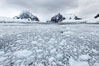 Lemaire Channel: mountains, sea, ice and clouds, Antarctica.  The Lemaire Channel, one of the most scenic places on the Antarctic Peninsula, is a straight 11 km long and only 1.6 km wide at its narrowest point. Image #25622